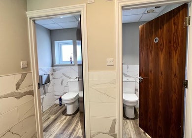 Elegant restroom with marble tiles at AURA MASSAGE AND CUPPING CLINIC, London, England, GB.