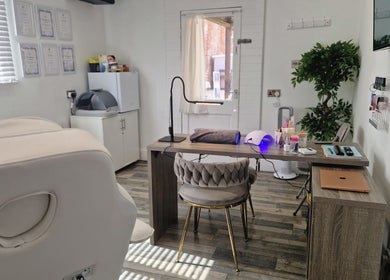 Cozy treatment room at Janie Louise Aesthetics & Beauty, Burton Upon Trent, England, GB featuring elegant decor.