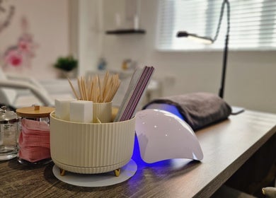Nail care setup at Janie Louise Aesthetics & Beauty, Burton Upon Trent, England, GB with manicure tools and lamp.