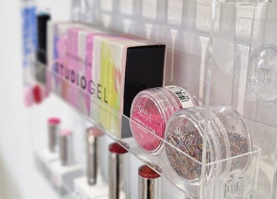 Cosmetics shelf at Janie Louise Aesthetics & Beauty in Burton Upon Trent, England, GB showcasing vibrant products.