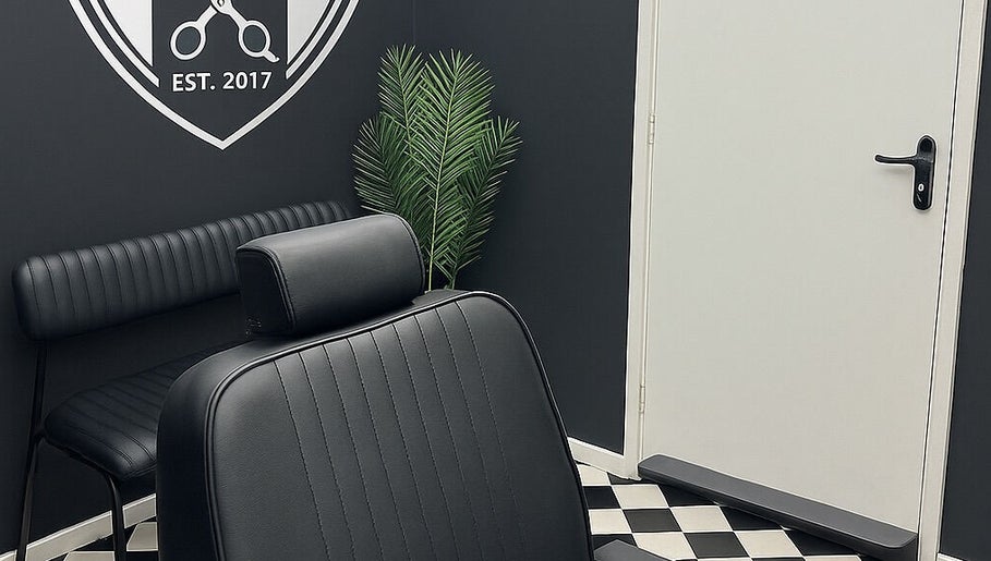 Modern black barber chair and decor at Rascal’s Barber Studio, Corby, England, GB.