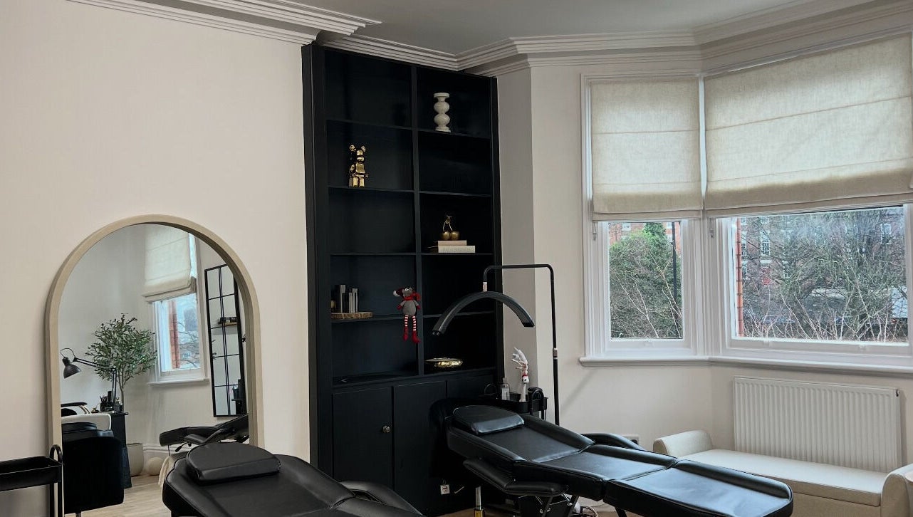 LEJBeautyRoom in Doncaster, England, GB features a serene treatment area with stylish black shelves and peaceful decor.