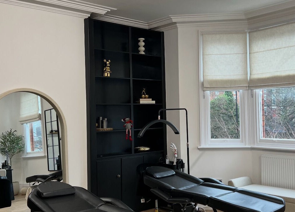 LEJBeautyRoom in Doncaster, England, GB features a serene treatment area with stylish black shelves and peaceful decor.