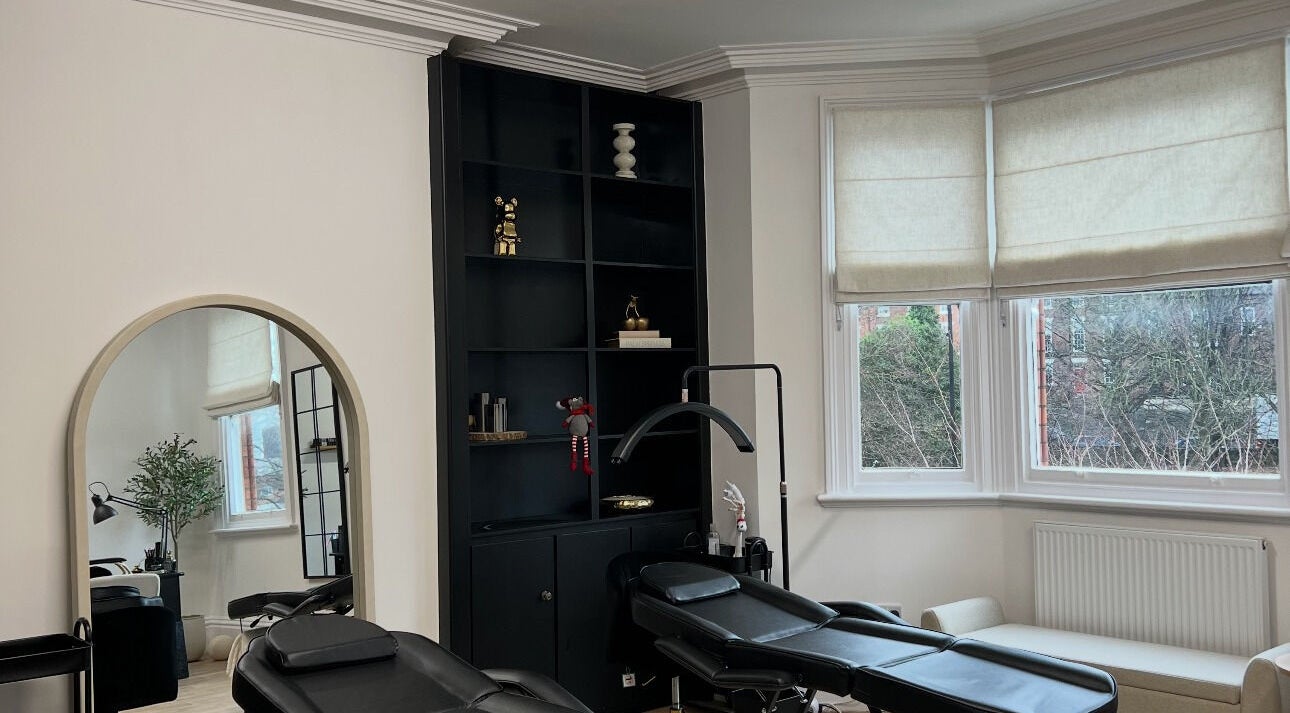 LEJBeautyRoom in Doncaster, England, GB features a serene treatment area with stylish black shelves and peaceful decor.