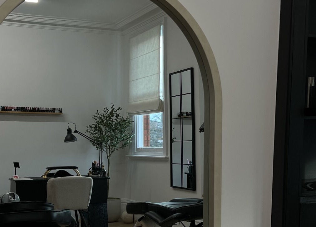 Serene interior of LEJBeautyRoom, Doncaster, England, GB, featuring a chic mirrored archway.