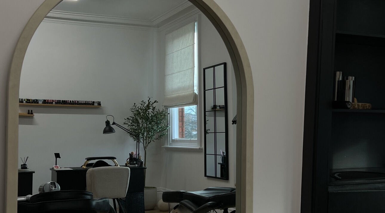 Serene interior of LEJBeautyRoom, Doncaster, England, GB, featuring a chic mirrored archway.