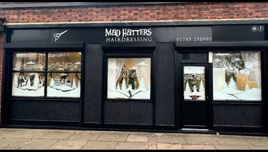 Front view of Arlenzo_hair salon in Stafford, England, GB with elegant seasonal window displays.