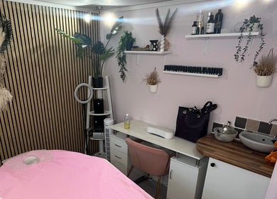 Madame Massage therapy room in Portsmouth, England, GB, featuring a serene décor with pink accents.