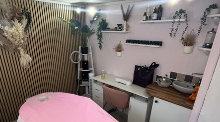 Madame Massage therapy room in Portsmouth, England, GB, featuring a serene décor with pink accents.