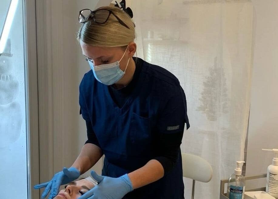 Aesthetician providing facial treatment at Vision Aesthetics and Skin, Chesterfield, England, GB.