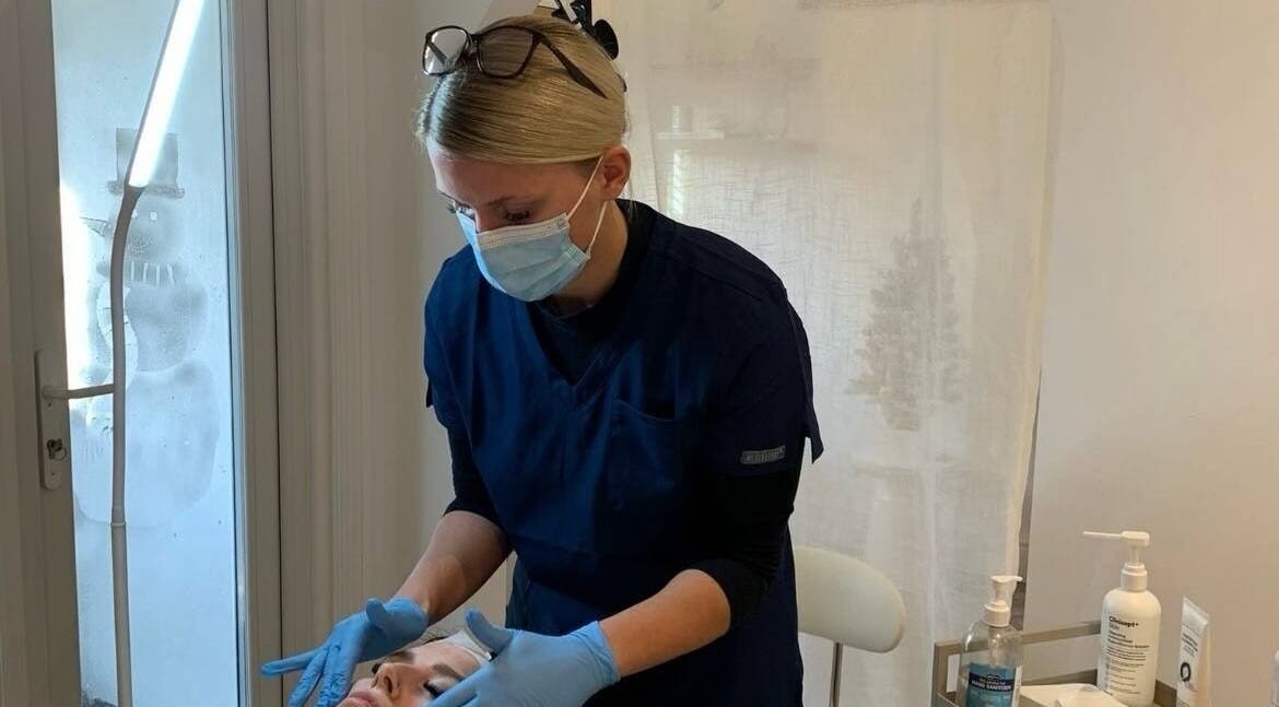 Aesthetician providing facial treatment at Vision Aesthetics and Skin, Chesterfield, England, GB.