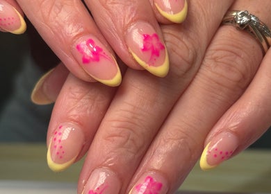 Floral pink and yellow nail art at Beautè By Millie, Douglas, GB.