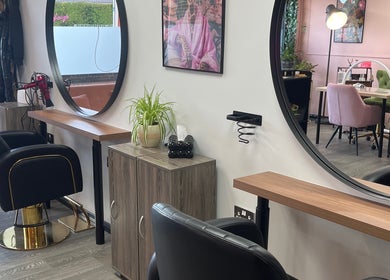 Elegant salon interior at The Dollshouse Hair By Nat, Shortheath, England, GB, featuring stylish salon chairs.