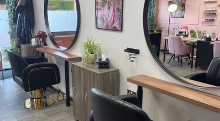 Elegant salon interior at The Dollshouse Hair By Nat, Shortheath, England, GB, featuring stylish salon chairs.