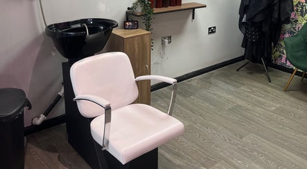 Sleek styling chair and basin at The Dollshouse Hair By Nat in Shortheath, England, GB.