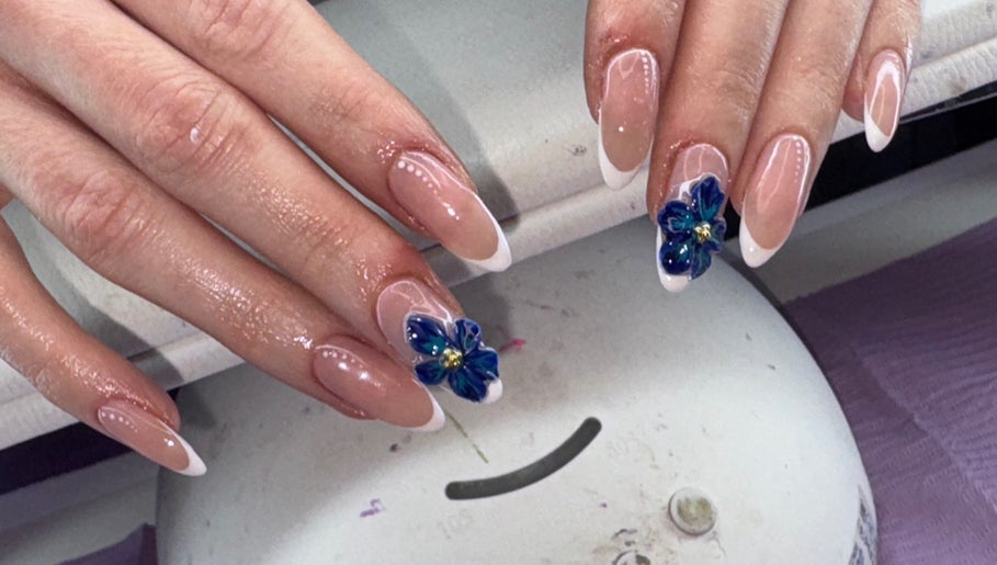 Elegant floral nail art at The Beauty Lair (inside Rose and Wild), London, England, GB; showcasing delicate designs.