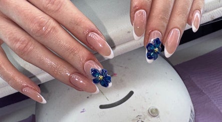 Elegant floral nail art at The Beauty Lair (inside Rose and Wild), London, England, GB; showcasing delicate designs.