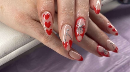 Red heart and bow nail art at The Beauty Lair (Inside Rose and Wild), London, England, GB.