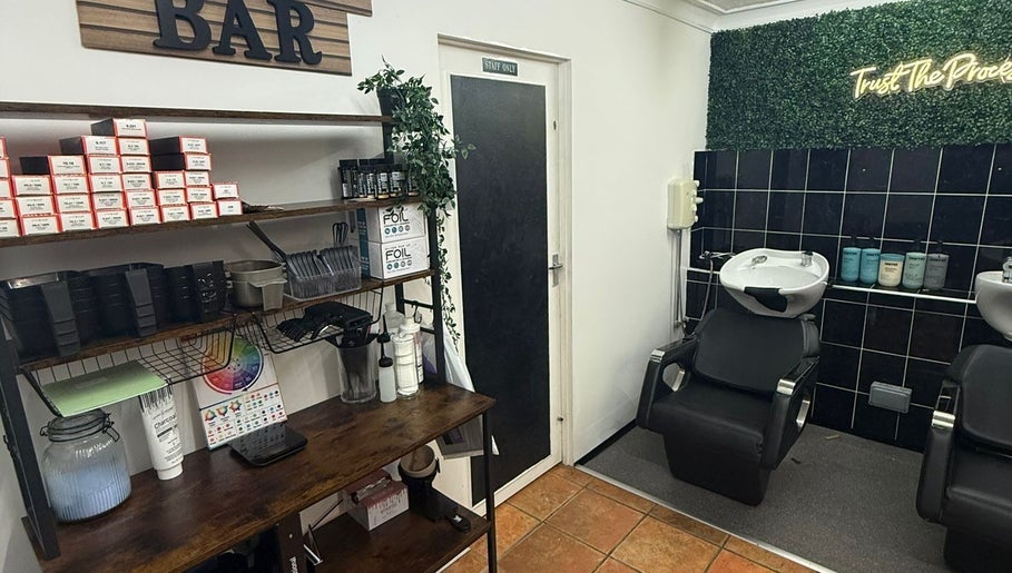 Sleek salon wash station at HairbyMichelle_210 in Lowestoft, England, GB with styling products and decor.