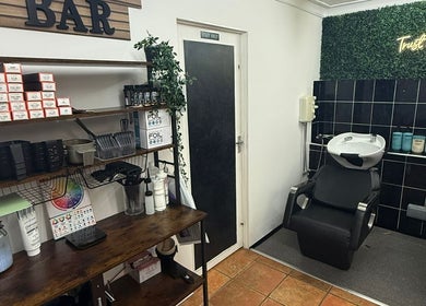 Sleek salon wash station at HairbyMichelle_210 in Lowestoft, England, GB with styling products and decor.