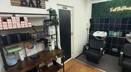 Sleek salon wash station at HairbyMichelle_210 in Lowestoft, England, GB with styling products and decor.