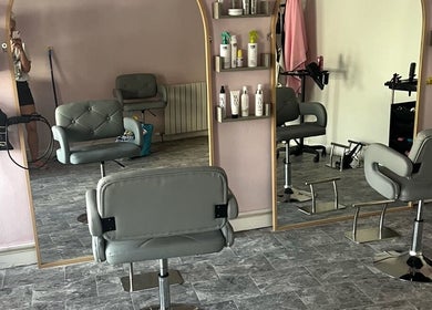 Modern salon chairs and mirrors at Lisas Hair Loft, Dumbarton, Scotland, GB.