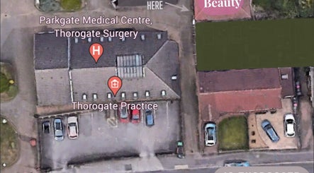 Aerial view of Serenity Beauty & Massage, Rawmarsh, England, GB, surrounded by medical centers.