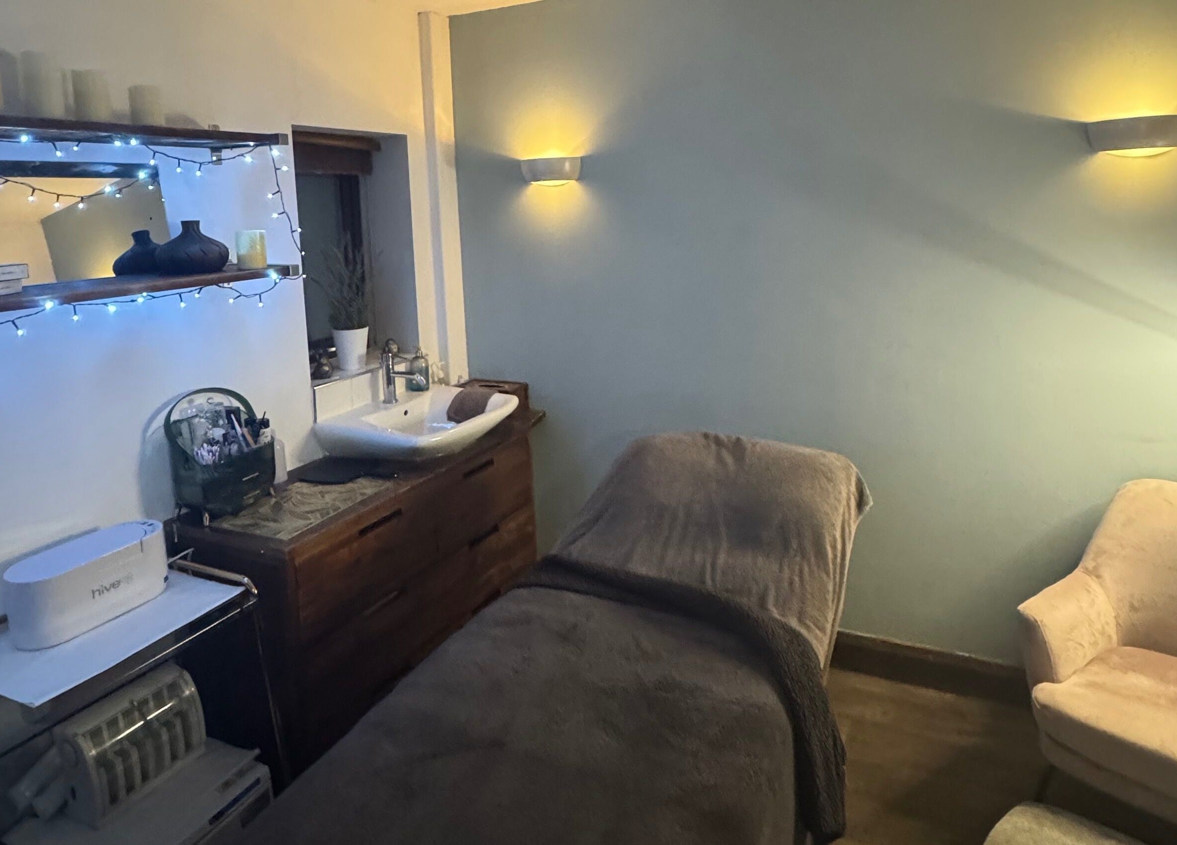Serenity Beauty & Massage treatment room with warm lighting in Rawmarsh, England, GB.