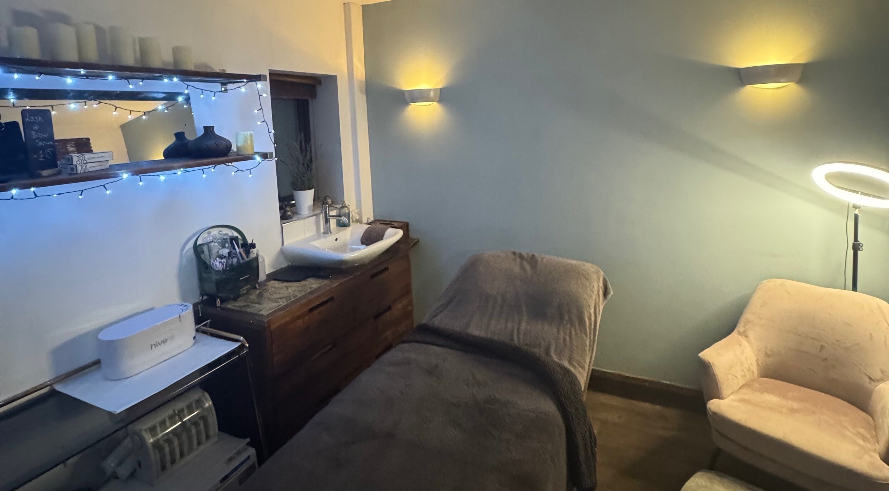 Serenity Beauty & Massage treatment room with warm lighting in Rawmarsh, England, GB.