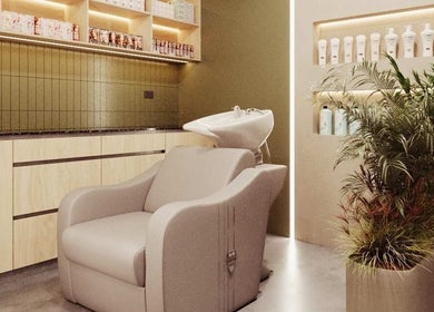 Modern hair wash station at Le Petit Hair & Nails Club, Samborondón, Guayas, EC, with sleek cabinets and plants.
