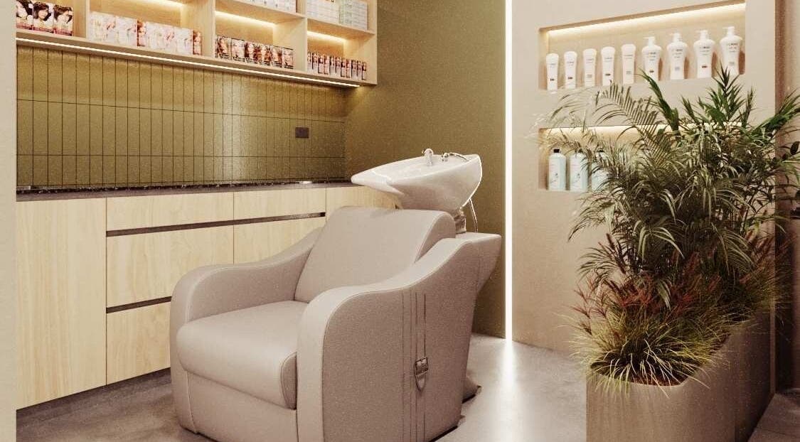 Modern hair wash station at Le Petit Hair & Nails Club, Samborondón, Guayas, EC, with sleek cabinets and plants.