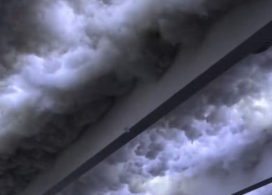 Dramatic cloud formations outside Allison Grace Sports Massage, Oldham, England, GB, enhancing a serene ambiance.