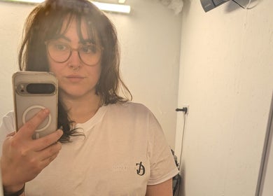 Person in Allison Grace Sports Massage shirt takes a selfie in Oldham, England, GB.