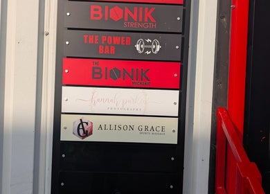 Allison Grace Sports Massage signboard at Oldham, England, GB emphasizing professional wellness services.
