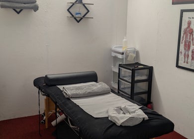 Cozy massage room at Allison Grace Sports Massage, Oldham, England, GB featuring a treatment bed.