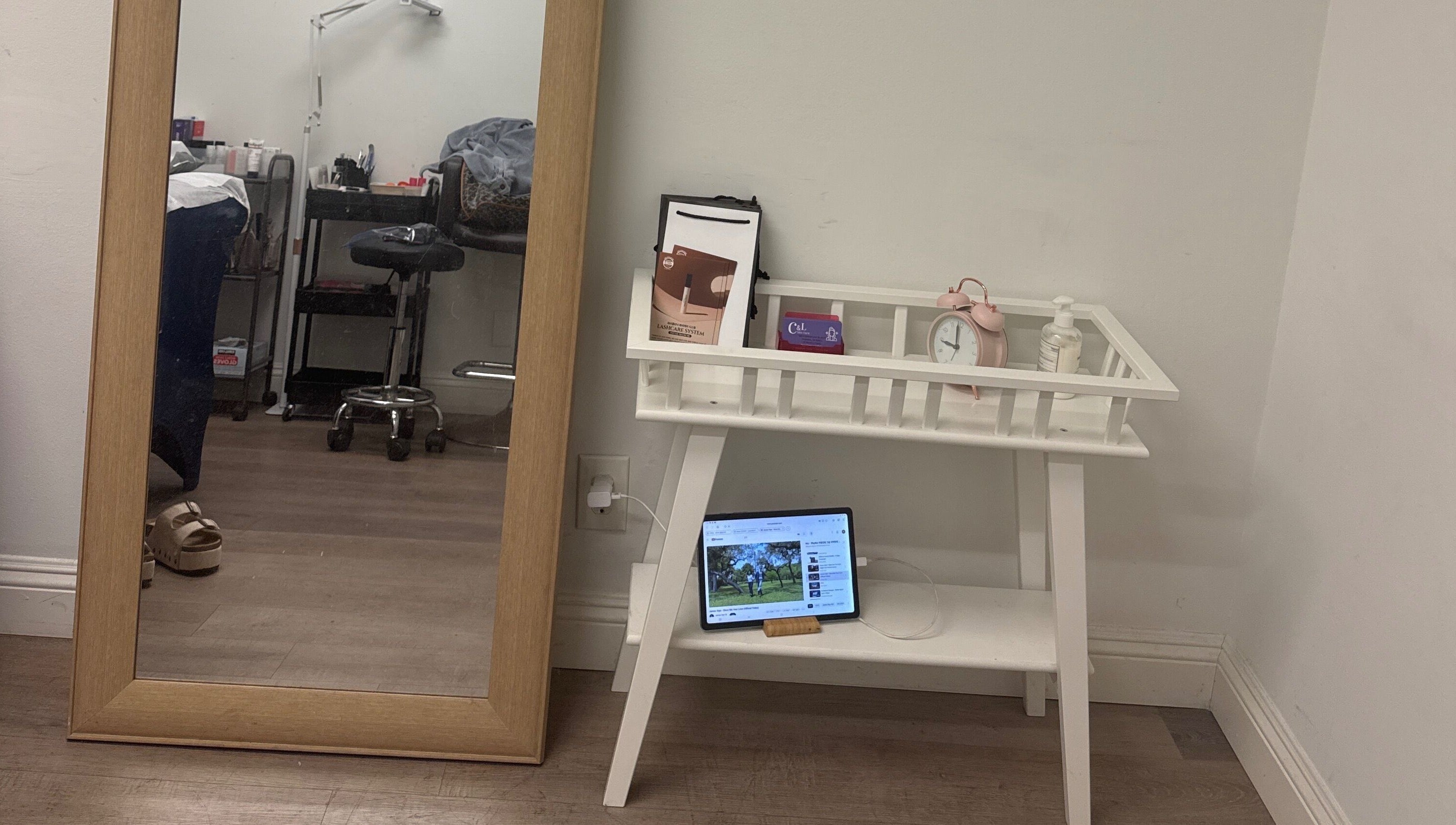 Cozy wellness corner at J.brow_oc, Anaheim, California, US with a mirror and a stylish white table.