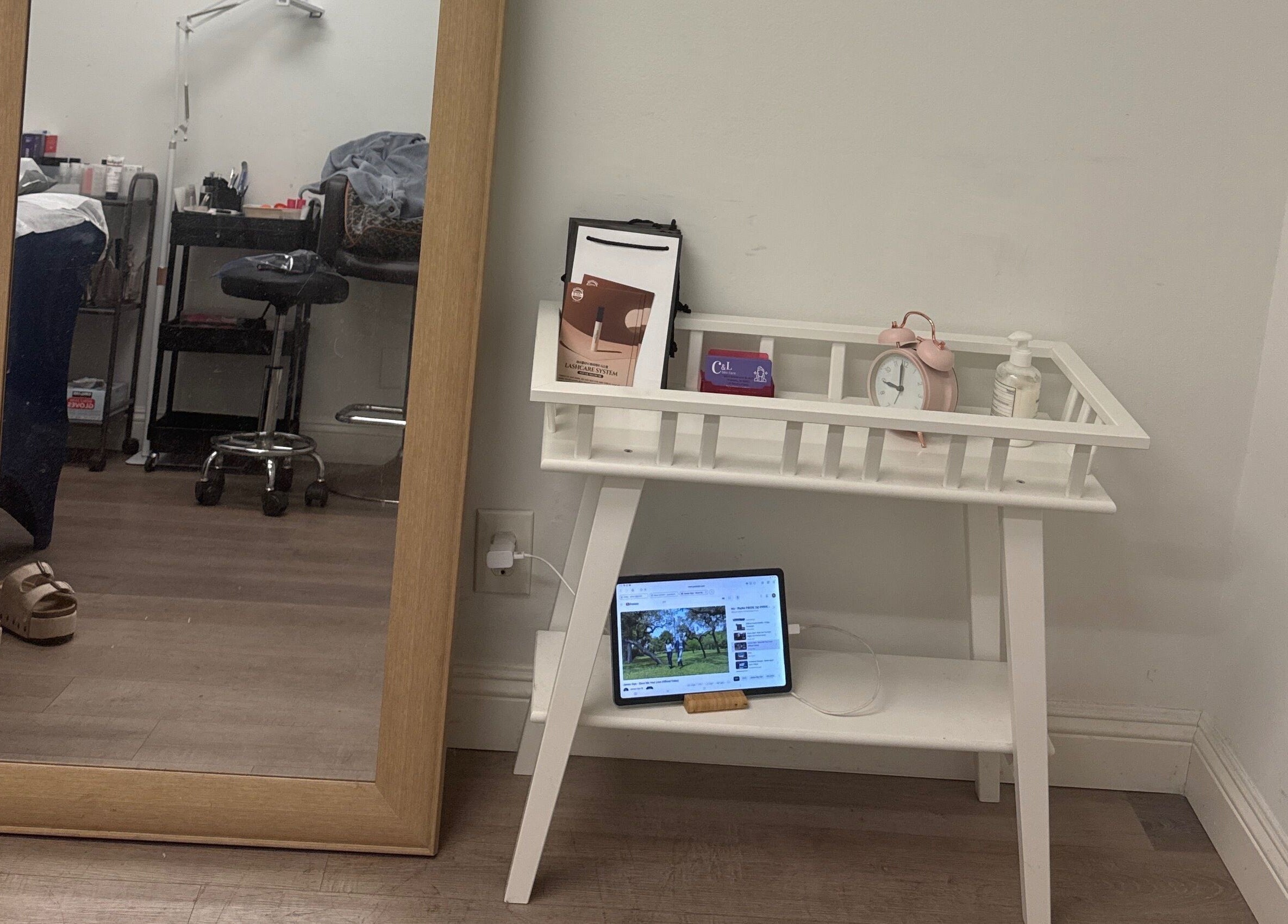 Cozy wellness corner at J.brow_oc, Anaheim, California, US with a mirror and a stylish white table.