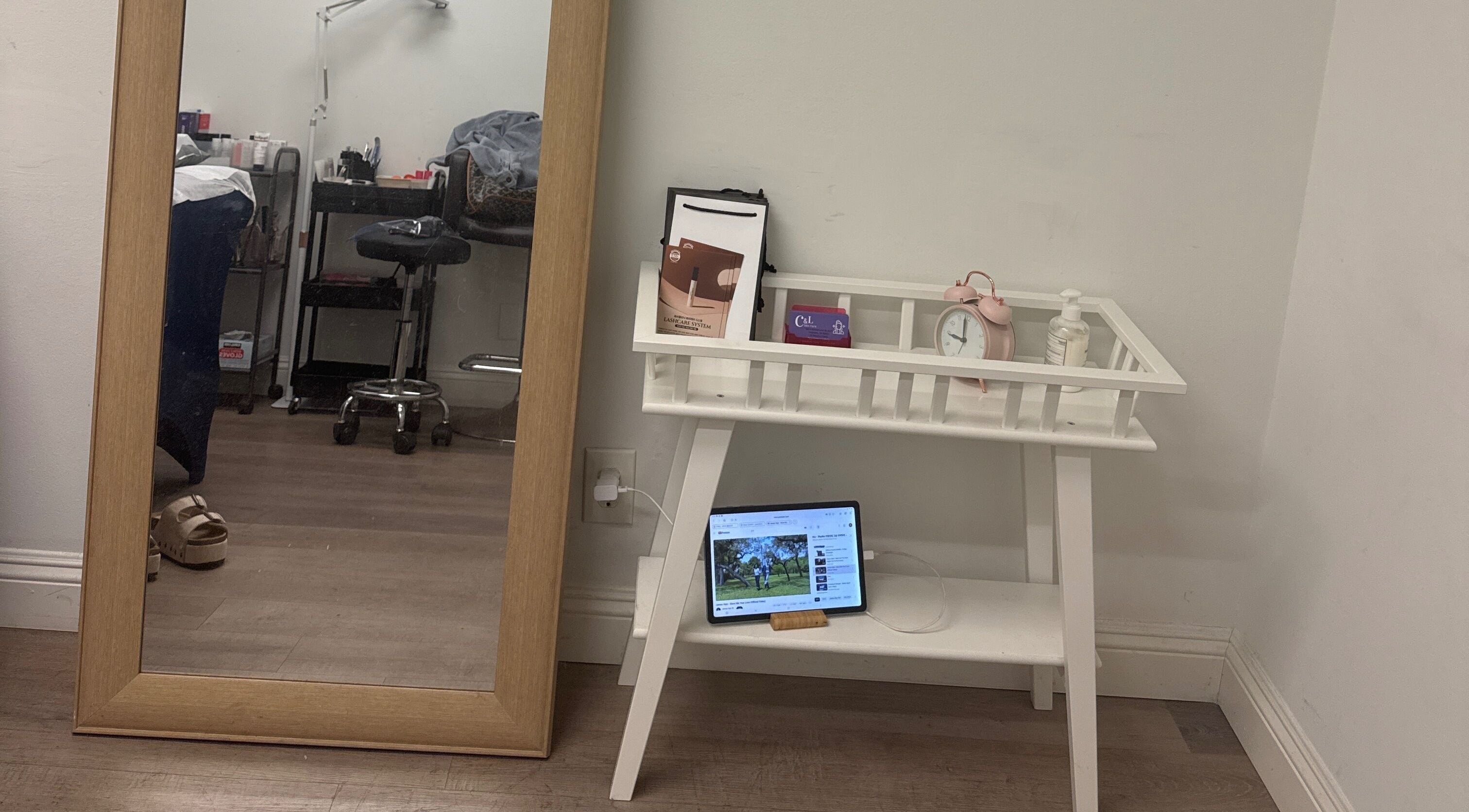 Cozy wellness corner at J.brow_oc, Anaheim, California, US with a mirror and a stylish white table.