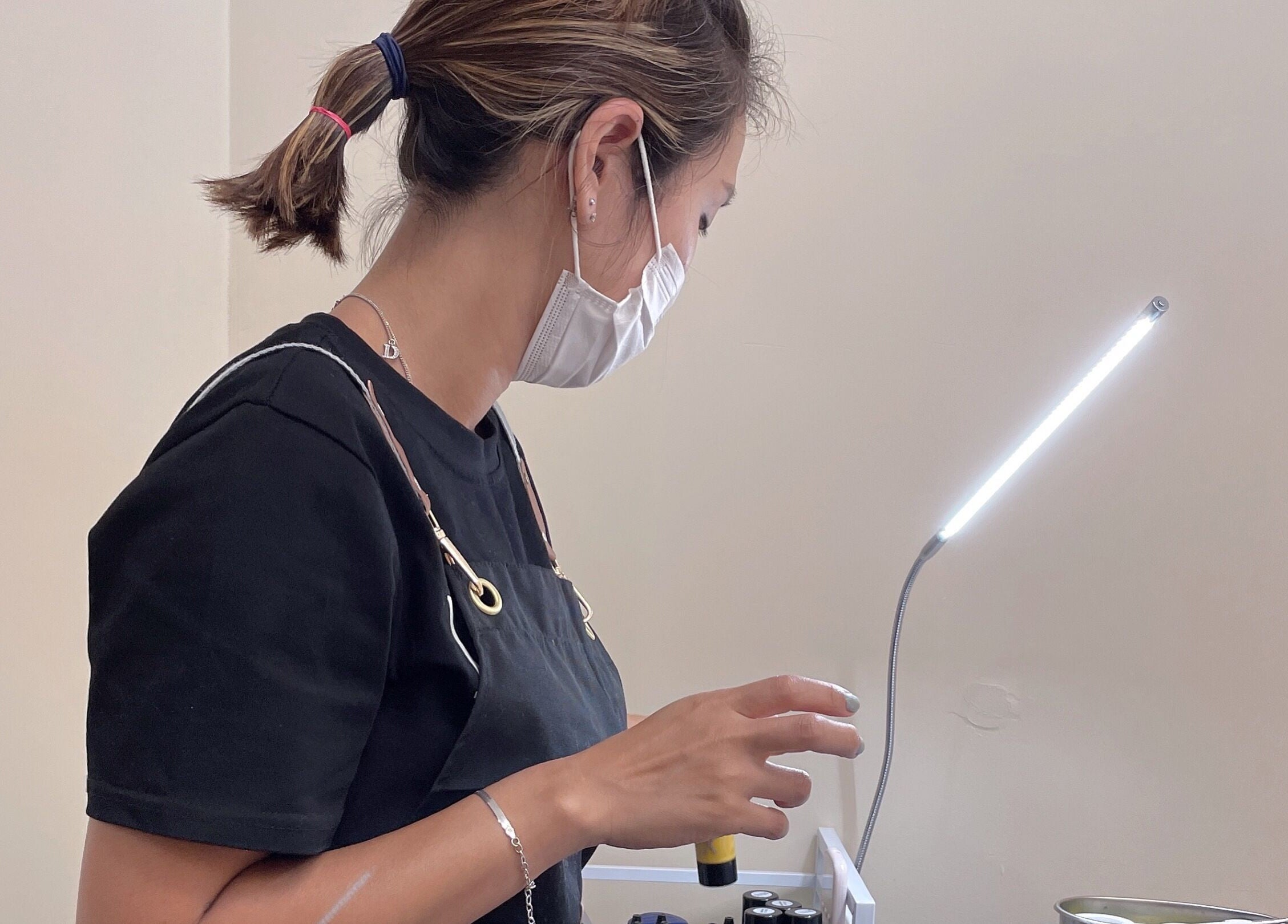 J.brow_oc beauty professional at work under light, Anaheim, California, US.