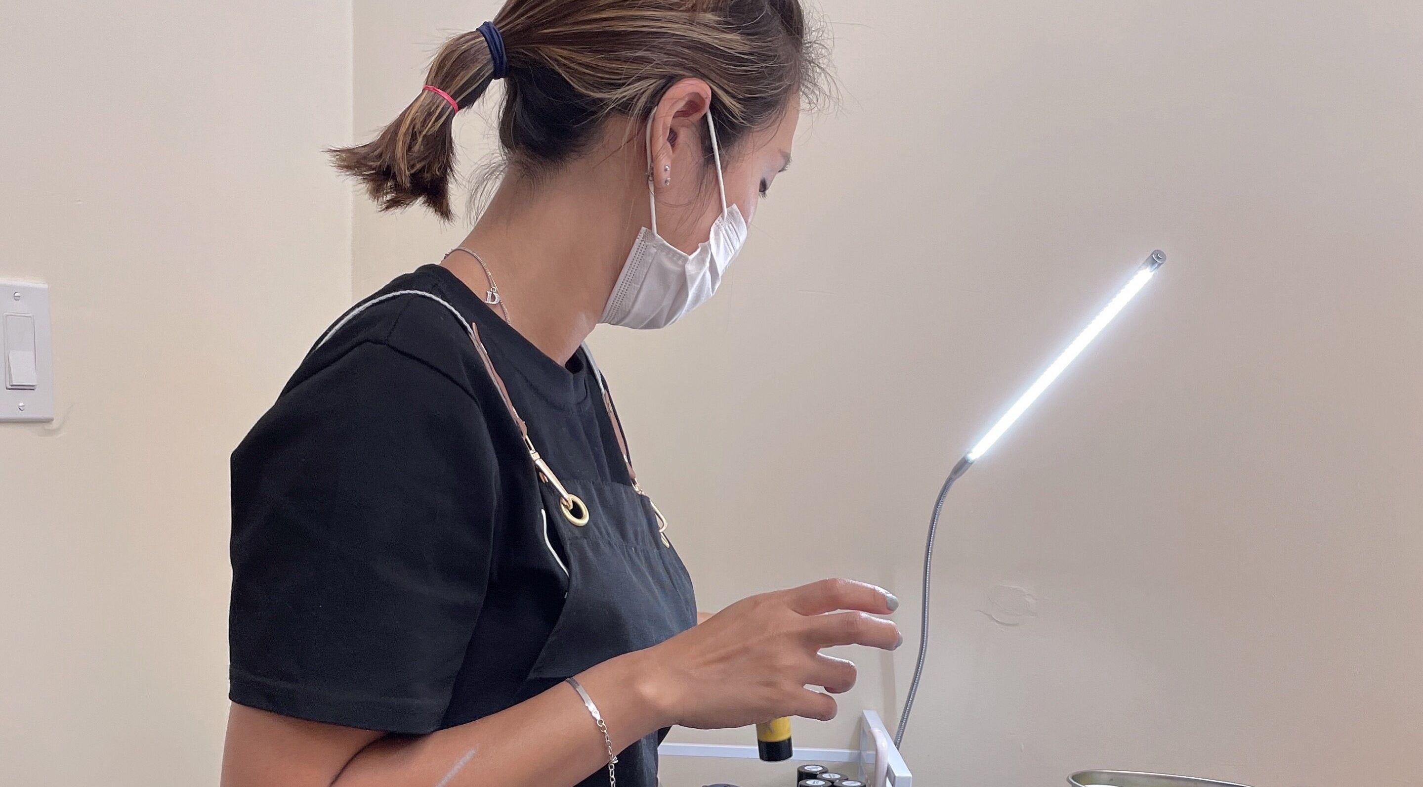 J.brow_oc beauty professional at work under light, Anaheim, California, US.