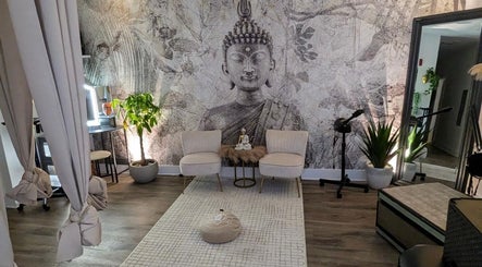 Relaxing Buddha mural room at Tranquil Touch Spa, Atlanta, Georgia, US, offering a serene ambiance.