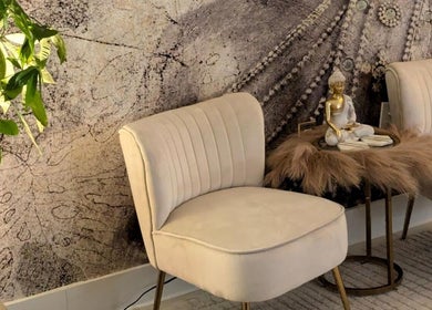 Relaxing zen decor with cozy chairs at Tranquil Touch Spa, Atlanta, Georgia, US.