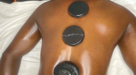 Hot stone massage at Tranquil Touch Spa, Atlanta, Georgia, US offers relaxation and rejuvenation.