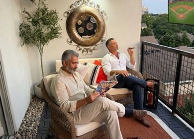 Relaxing rooftop patio scene at Tranquil Touch Spa in Atlanta, Georgia, US with guests enjoying a serene evening.
