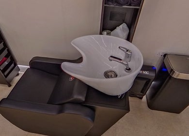 Modern wash station at MarkconHDCUTZ, London, England, GB, providing luxurious beauty treatments.