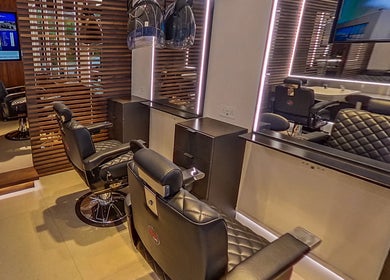 Modern salon chairs at MarkconHDCUTZ in London, England, GB, featuring sleek design and luxurious comfort.