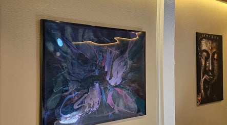 Abstract painting and Buddha art in Dharma River ZenFloat Spa in Daphne, Alabama, US.