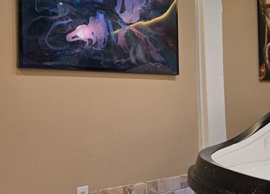Artistic wall decor beside spa pod at Dharma River ZenFloat Spa, Daphne, Alabama, US.