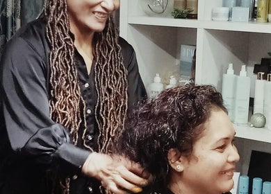 Stylist working at Blue Pacific Organic Salon in Suva, Central Division, FJ, offering professional hair care.
