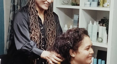 Stylist working at Blue Pacific Organic Salon in Suva, Central Division, FJ, offering professional hair care.